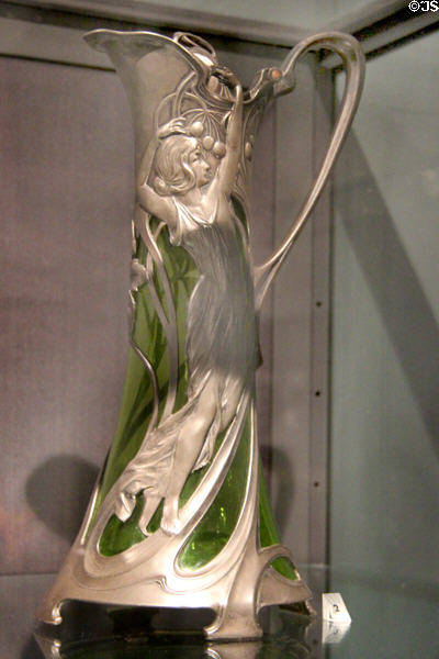 Art Nouveau silver-plate & green glass claret jug (c1900-05) by Albert Mayer for Württembergiche Metallwarenfabrik of Geislingen, Germany at Royal Ontario Museum. Toronto, ON.