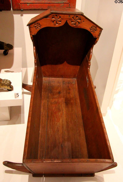 Hooded cradle (c1800-50) from Quebec at Royal Ontario Museum. Toronto, ON.