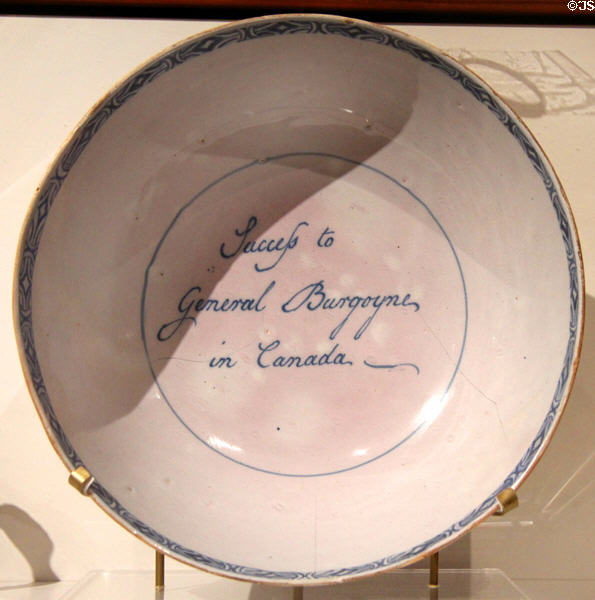 Liverpool earthenware punch bowl (c1777) with inscription "Success to General Bourgoyne in Canada" where he lead British troops to defeat at Saratoga at Royal Ontario Museum. Toronto, ON.