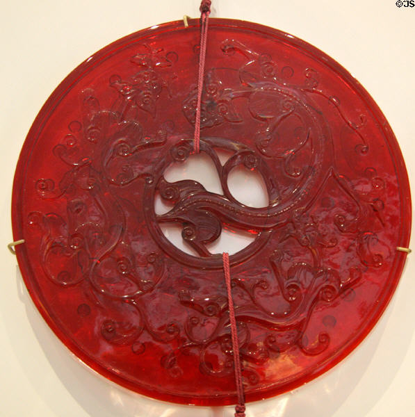 Red glass disc (c1750-1911 - Qing dynasty) at Royal Ontario Museum. Toronto, ON.