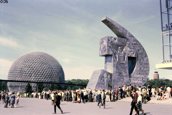 Geodesic dome of United States Pavilion with socialist realism hammer & sickle sculpture (1967) beside USSR Pavilion at Expo 67. Montreal, QC.