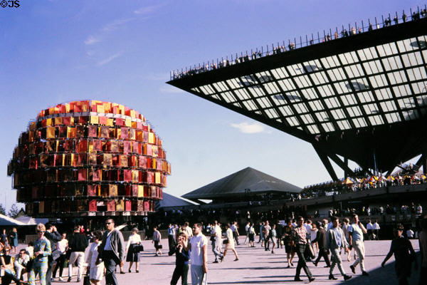 Canadian Pavilion with orange People Tree showing portraits of Canadians & Katimavik inverted pyramid at Expo 67. Montreal, QC.