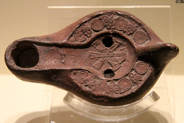 Terracotta late-Roman oil lamp with Christian symbol (450-550 CE) from North Africa at Montreal Museum of Fine Arts. Montreal, QC.
