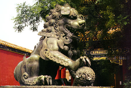 Male lion statue in front of the Lama Temple in Beijing. China.