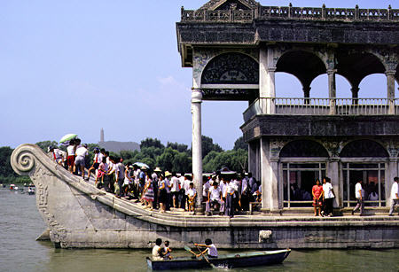 Tourists aboard the non-floating marble boat in the Summer Palace lake, Beijing. China.