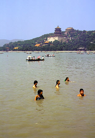 Swimming and boating in Kunming Lake, Summer Palace Park, Beijing. China.