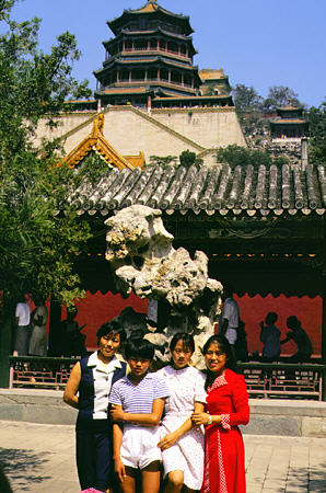 Family posing in front of a building at the Summer Palace park, Beijing. China.