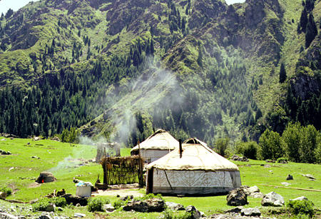 Yurts, a type of hut with a frame covered by a skin, used by nomads near Heavenly Lake. China.