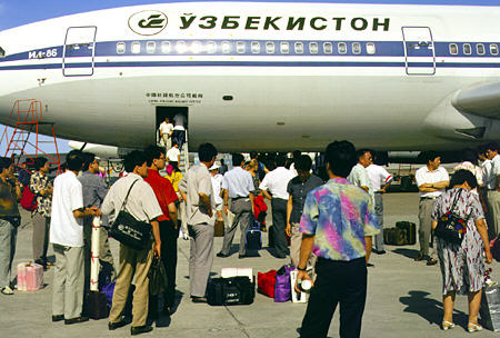 Arrival of Russian-made Ilyushin 86 jumbo jet into Urumqi airport. China.