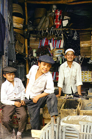 Kids in a shop in Kashgar. China.
