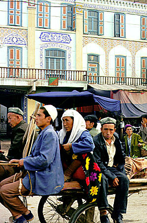 Riding a cart in the Sunday market, Kashgar. China.
