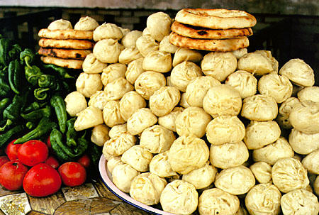 Dumplings, nan, and vegetables all available at Sunday market in Kashgar. China.