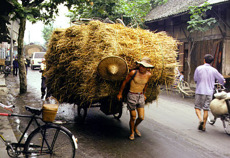 Farmers walk the countryside streets in Chengdu. China.