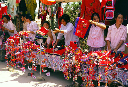 Vendors selling colorful sewn trinkets outside of Quin Tombs in Xi'an. China.