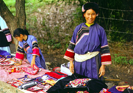 Sani people selling their craftwork at the stone forest near Kunming. China.