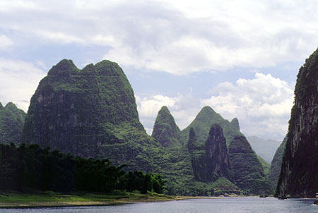 Sculptural rocky hills surround the Li River in Kweilin. China.