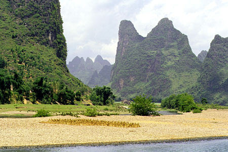 Rocky shores of the Li River as it makes its way through the Kweilin region. China.