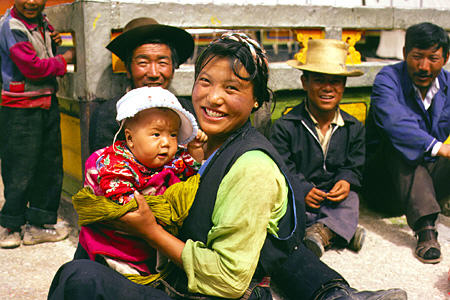Smiling Tibetan mother and child in Lhasa. China.