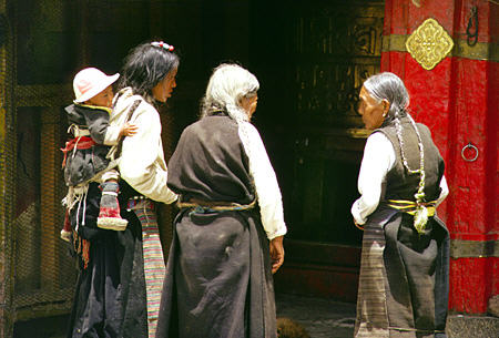 Women with braided hair on the streets of Lhasa, Tibet. China.