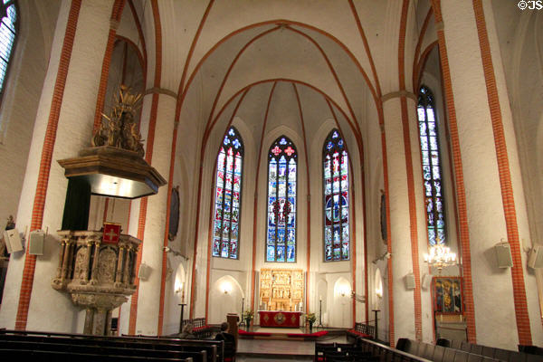 Pulpit, altar & stained glass windows depicting the important events of the ecclesiastical (mid-20thC) by Charles Crodel in St Jacobi Church. Hamburg, Germany.