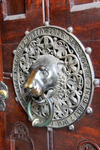 Bronze lion head door pull (1342) on entrance to St Peter's Church. Hamburg, Germany.