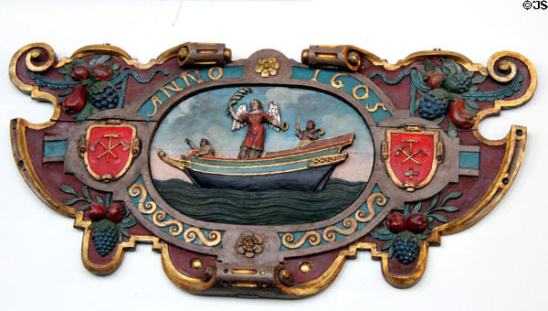 Shop sign of shipbuilder (1605) with ship protected by angel & guild emblems at Hamburg History Museum. Hamburg, Germany.