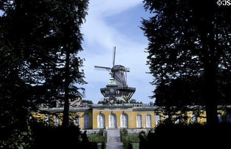 New Rooms (Neue Kammern) or orangery (1747) with windmill behind in Sanssouci garden. Potsdam, Germany. Architect: Georg Wenzelaus von Knobelsdorff.