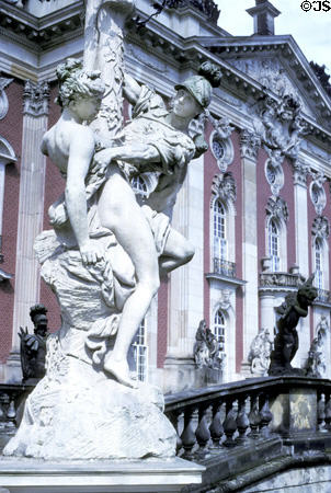 Sculpted couple embrace on lamp at Neues Palais. Potsdam, Germany.