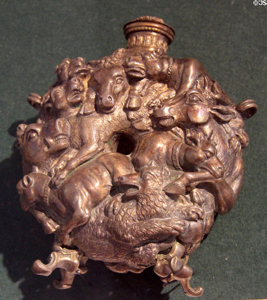 German powder flask (1st half 18thC) with entwined animals: boar, cattle, wolves, attacking dogs at German Hunting & Fishing Museum. Munich, Germany.
