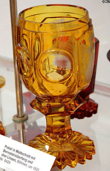 Matte-cut cup with outer amber layer cut away (c1835) from Bohemia at German Hunting & Fishing Museum. Munich, Germany.