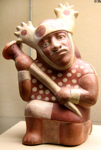 Moche culture ceramic vessel in shape of kneeling warrior with a club (100 BCE- 600 CE) from north coast of Peru at Five Continents Museum. Munich, Germany.