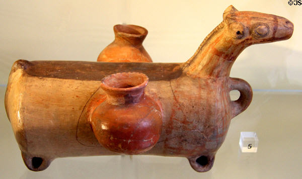 Early iron age ceramic vessel in shape of packhorse hung with pots (9th-7thC BCE) from Syria at Pergamon Museum. Berlin, Germany.