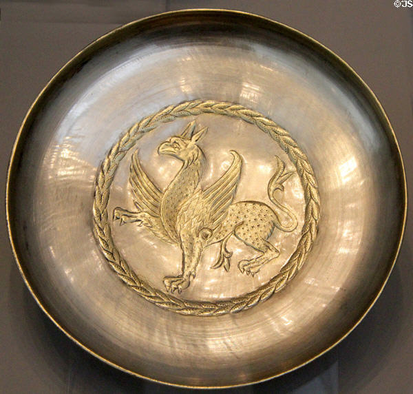 Partially gilded silver plate with griffin (7th-8thC) from Iran at Pergamon Museum. Berlin, Germany.