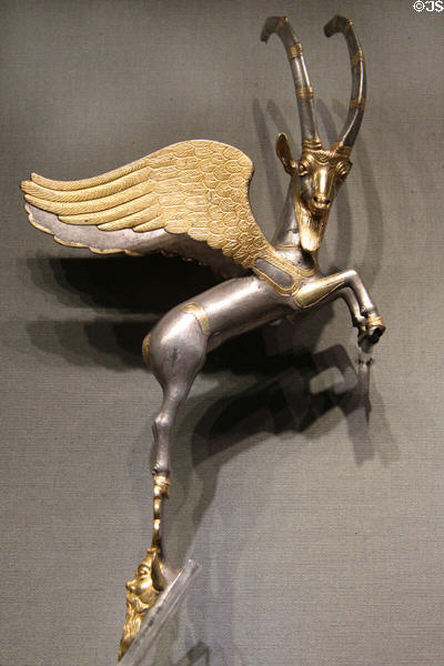 Persian winged bezoar goat handle for a silver amphora (400-350 BCE) from Euphrates, Anatolia at Altes Museum. Berlin, Germany.