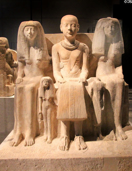 Egyptian stone statue of family group (c1250-1200 BCE) (New Kingdom, 19th Dynasty) at Neues Museum. Berlin, Germany.