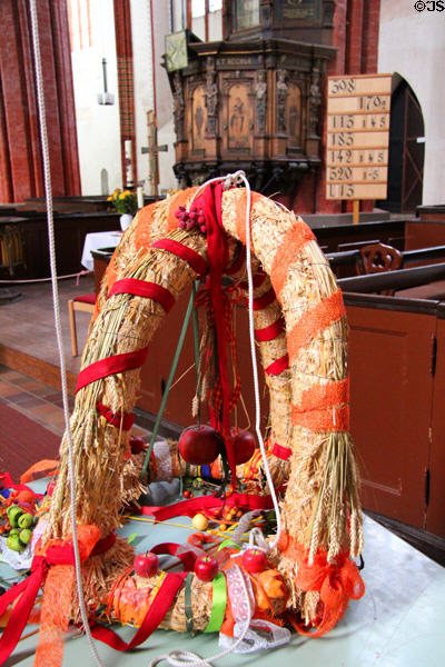 German harvest festival wreath (Erntedánkfest) wreath at St Mary's Church. Greifswald, Germany.