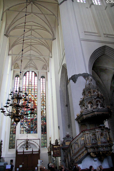 Stained glass beyond pulpit at St Mary's Church. Rostock, Germany.