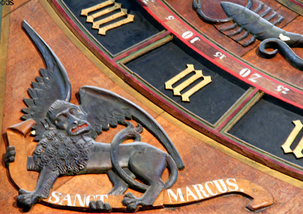 Winged lion of Evangelist Mark decorates Medieval astronomical clock (1472) at St Mary's Church. Rostock, Germany.