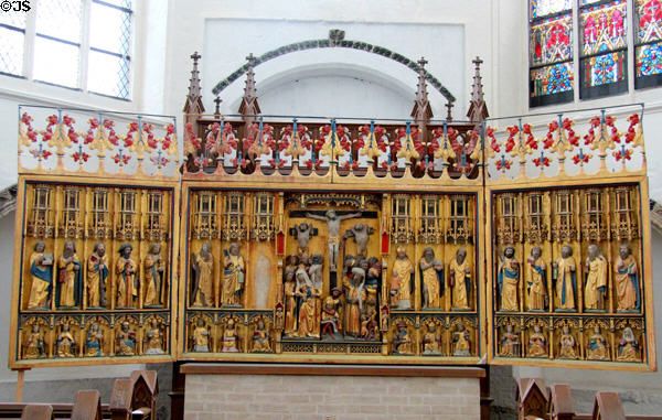 Altar with crucifixion flanked by Apostles & Saints at St Mary's Church. Rostock, Germany.