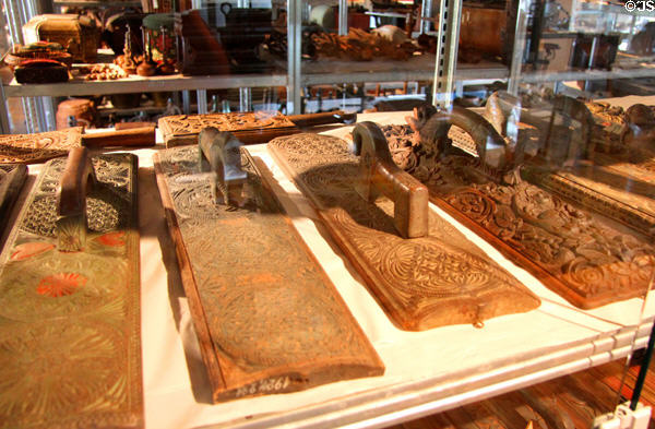 Collection of carved long boards with handles for straightening bed linens (19thC) at Schleswig Holstein State Museum. Schleswig, Germany.