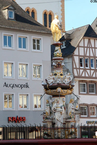 St Peter's Fountain & Germanic residence facades in Hauptmarkt. Trier, Germany.