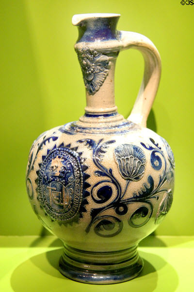 Stoneware jug painted with arms (c1700) from Westerwald at Trier Archaeological Museum. Trier, Germany.