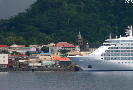 Church spires of Roseau skyline dwarfed by cruise ship. Roseau, Dominica.