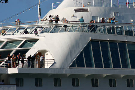 Passengers line deck of Norwegian Sky. Dominica.