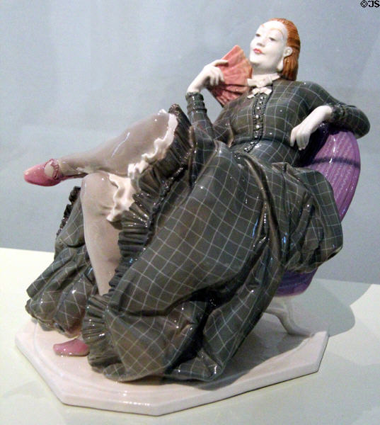 Woman in armchair porcelain figurine (1906) by Josef Wackerle for Nymphenburg & painted (1909) by Carl Ludwig Frenzel at Bavarian National Museum. Munich, Germany.