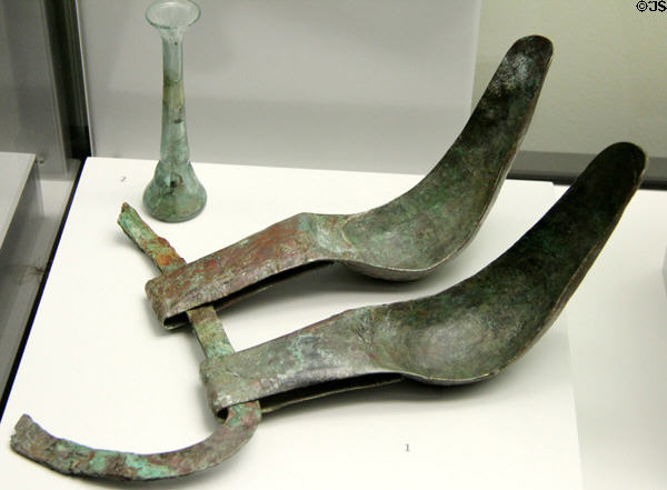 Roman stirgiles for scraping sweat off skin plus glass bottle for balms found near Augsburg at Bavarian State Archaeological Collection. Munich, Germany.