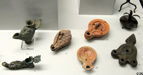Roman-era bronze, iron & ceramic oil lamps at Bavarian State Archaeological Collection. Munich, Germany.