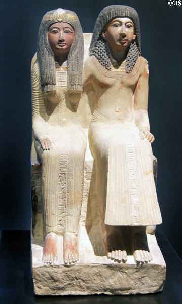 Seated figure of priest Neye & his mother Mutnofret of limestone (19th Dynasty - c1250 BCE) from West Thebes at Museum Ägyptischer Kunst. Munich, Germany.