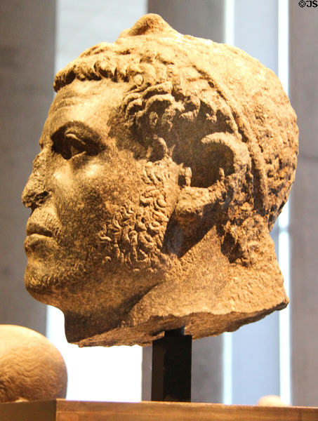 Portrait head of man wearing lotus-bud diadem of granite (Ptolemaic-Roman Dynasty - 1stC BCE) from Dime? at Museum Ägyptischer Kunst. Munich, Germany.