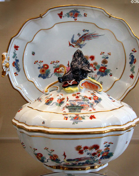 Meissen porcelain lidded terrine with handle in shape of wild boar painted with phoenix (c1740-5) at Meissen porcelain museum at Lustheim Palace. Munich, Germany.